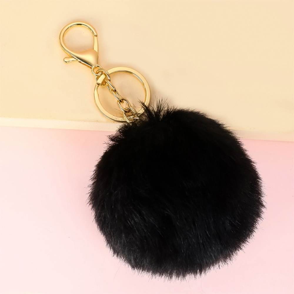 Plush Pom Pom charm! The best purse accessory! Available in red or black.